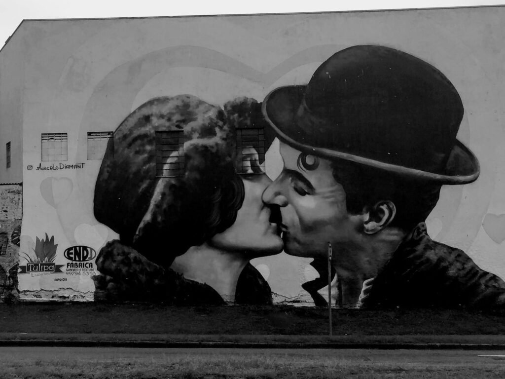 man kissing womans cheek