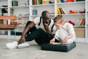 a man teaching a child