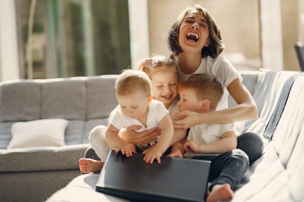 happy mother with children sitting at home