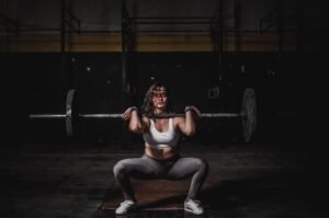 woman lifting barbell