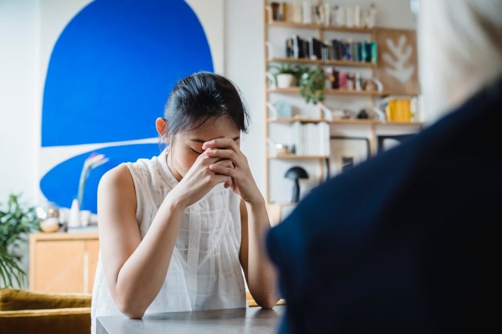 worried woman during session with therapist
