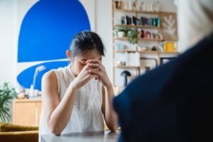worried woman during session with therapist