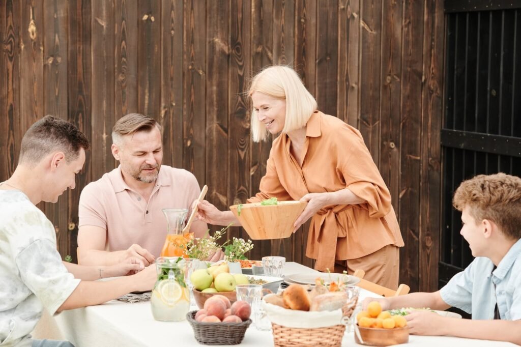 woman serving food for the family