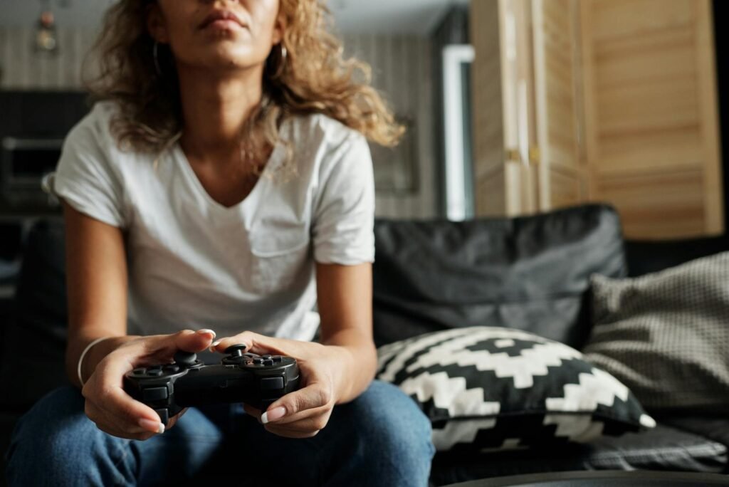 photo of woman using game controller